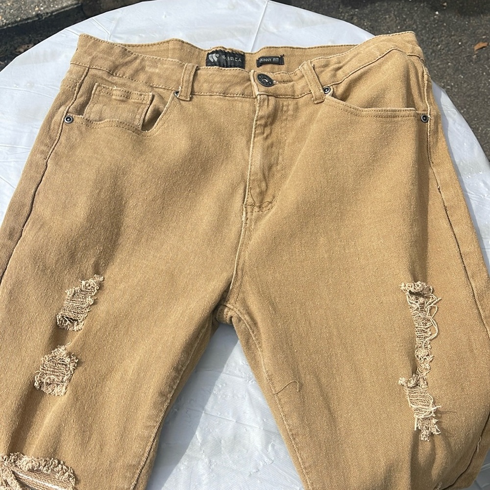 Tan jeans with rips